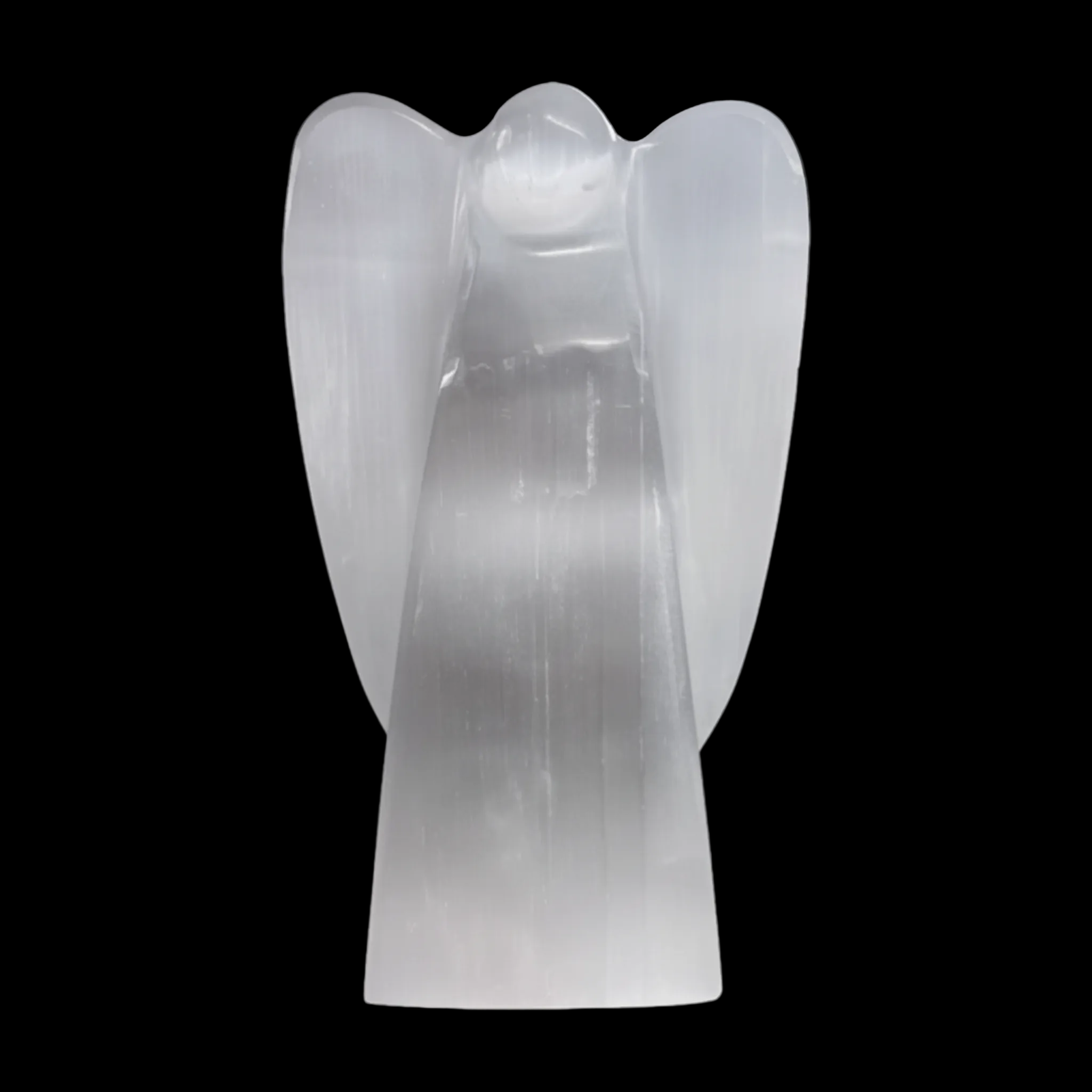 Natural selenite angel lamp carving on a black background
