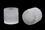Pair of natural selenite candle holders with polished tops carved from Moroccan selenite on black background