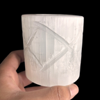 Natural Moroccan selenite diamond candle holder displayed in hand for size reference