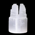 Polished selenite double mountain tower crystal carved from natural Moroccan selenite on black background