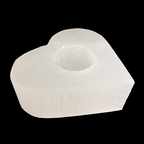 Heart shaped natural selenite candle holder with polished top carved from Moroccan selenite on black background