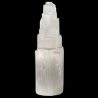 Natural selenite mountain lamp on black background
