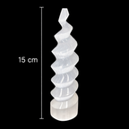 15cm polished selenite spiral tower crystal on black background with measurement scale