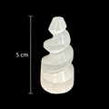 5cm polished mini selenite spiral tower crystal on black background with measurement scale
